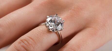 A woman wearing an engagement ring