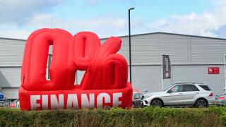 advertisement of zero percent finance available outside car dealership knaresborough yorkshire united kingdom