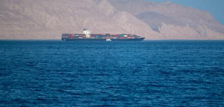 Bukha, OMAN - MAY 28 2021: Iranian coastline near the Strait of Hormuz. giant sea container ship in the strait of Hormuz. Near East