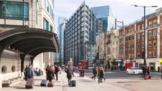 People in Bishopsgate, City of London street scene, looking towards the RBS building, Spitalfields East London UK