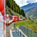 Zermatt 24,5,2023: Glacier Express red swiss train in Swiss Alps.Zermatt to St.Moritz. Switzerland in summer