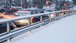 Cars in a traffic jam on winter street in Finland