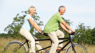 Mature couple riding tandem