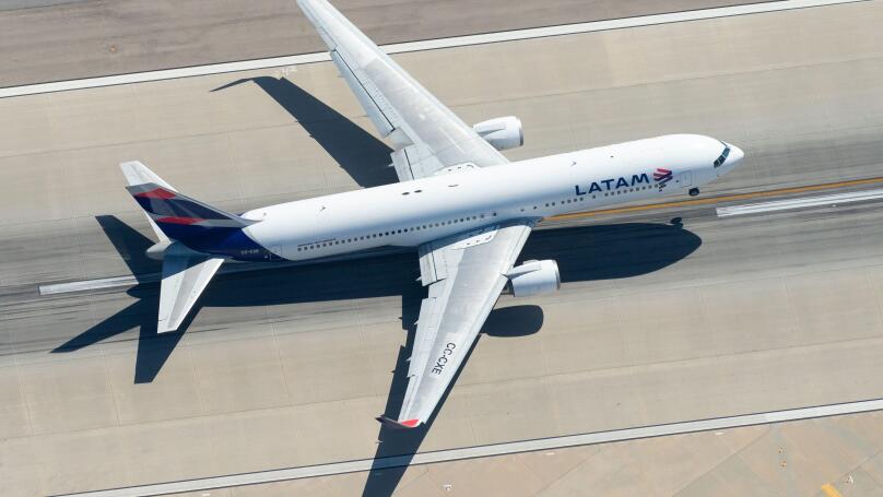 Aerial view of LATAM Airlines Boeing 767 CC-CXE departing LAX airport bound for Santiago (SCL), Chile. Widebody long haul aircraft seen from above.