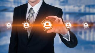 Human resource business concept. Businessman presses hr icon on virtual screen