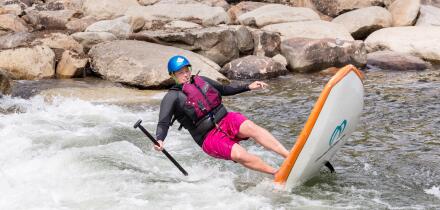 Stand up paddleboarder falling in white water. Image shot 09/2014. Exact date unknown.