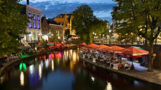 Bars and restaurants along Oudegracht canal come alive at night in Utrecht