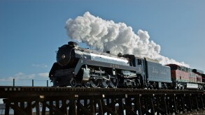 Restored CPR Royal Hudson 2860 steam engine crossing Serpentine River estuary railway train trestle