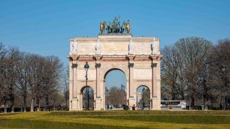Arc de Triomphe du Carrousel on a sunny spring day in Place du Carrousel, Paris, France