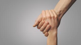 help friend through a tough time. rescue gesture. support, friendship and salvation concept. holding hands