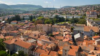 France, Aveyron, Midi-Pyrenees, Millau, cityscape view over the town centre from The Belfrey with Viaduc de Millau viaduct