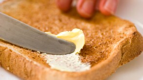 buttering toast. Image shot 2006. Exact date unknown.