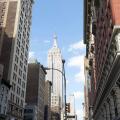 the burton building looking up 5th avenue with view of the empire state building New York City USA