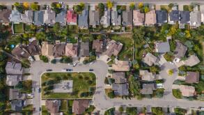 Aerial top down view of houses and streets in beautiful residential neighbourhood during fall season in Calgary, Alberta, Canada.
