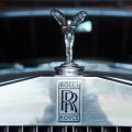 closeup of Rolls Royce logo on car