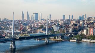 Golden Horn Metro Bridge with old and modern side of Istanbul background view during the day time. Lots of building and sea view