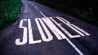 Slower Road Sign