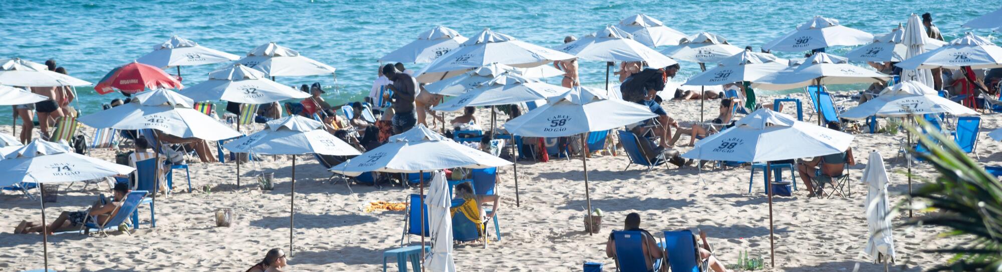 Salvador, Bahia, Brazil - January 24, 2025: Hundreds of people are seen on Paciencia beach sunbathing in the city of Salvador, Bahia.