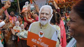 Mumbai, India. 04th June, 2024. A supporter of the Bharatiya Janata Party (BJP) holds a cut out of India's Prime Minister Narendra Modi as they celebrate the victory outside the Bharatiya Janata Party (BJP) office. Supporters of Bharatiya Janata Party (BJ