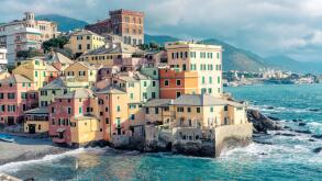 Italy, Liguria, Genoa, Pastel colored houses in Boccadasse district