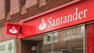 Santander bank logo and sign above the local branch front window in Wrexham, North Wales, UK, Britain