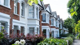 Street of typical terraced houses - London UK