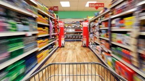 Shopping Trolley Speeding Down a Supermarket Aisle, UK.