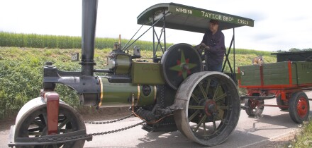 A steam roller rumbles through rural Essex