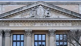 Stone coat of arms of Bank of Montreal on traditional classical style building