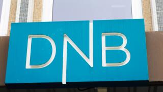 Trondheim, Norway - September 26, 2015: Close-up of the sign at the DNB office entrance. DNB is a Norwegian financial services group.