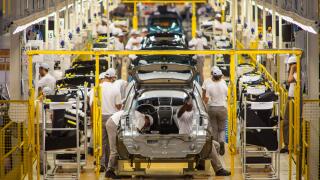 Automobile industry blue collar workers - Assembly line at Nissan Resende factory in Brazil.