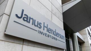 A logo sign outside of a facility occupied by the Janus Henderson Group in Denver, Colorado, on July 23, 2018.