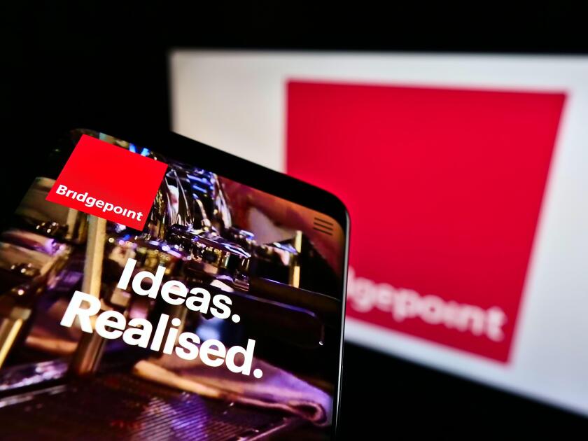 Mobile phone with website of private equity firm Bridgepoint Advisers Ltd on screen in front of business logo. Focus on top-left of phone display.
