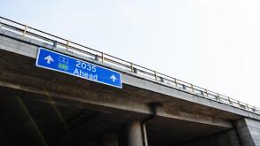 2035 Ahead Blue Road Sign Against Clear Sky