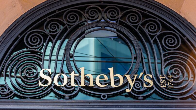 Sign and logo at the entrance to the Sotheby's building in Geneva. Sotheby's is a multinational company specializing in fine art and luxury objects
