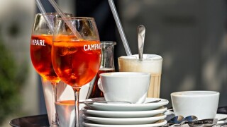 Glasses of Campari Soda with Cups of Coffee on Tray