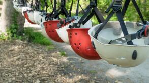 Row with red and white safety helmets