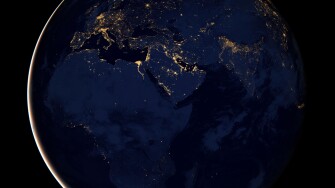 Full Earth showing city lights of Africa, Europe, and the Middle East.
