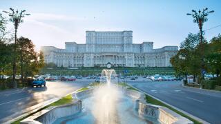 Bucharest Parliament with fountain in front of it. Romania