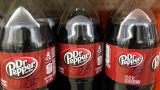 FILE - This April 28, 2016, file photo shows bottles of Dr. Pepper on a store shelf at Quality Cash Market in Concord, N.H. Keurig is buying Dr. Pepper Snapple Group Inc. to create a beverage business with approximately $11 billion in annual sales, announ
