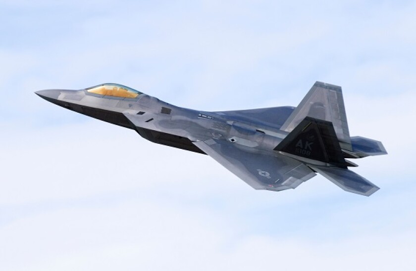 F-22 Raptor plane operated by the US Air Force climbing after take off from RAF Fairford. Aircraft is a Lockheed Martin F-22A Raptor.