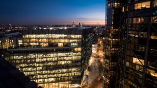 Business London at Night. Dusk and sunset view over London dominated by illuminated modern office blocks.