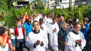 Salvador, Bahia, Brazil - Abril 02, 2023: Seminarians and Catholic worshipers walk during the Palm Sunday procession in Salvador, Bahia.