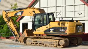 Parked Caterpillar construction equipment (Digger / Excavator).