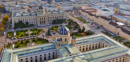 A magnificent aerial shot of Vienna?s MuseumsQuartier, featuring the Kunsthistorisches Museum and lush gardens, showcasing architectural brilliance an