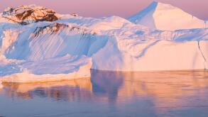 Climate Change and Global Warming - Icebergs from melting glacier in icefjord in Ilulissat, Greenland. Aerial image of arctic nature ice landscape. Unesco World Heritage Site.