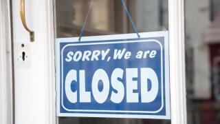 Closed sign on shop door, UK.