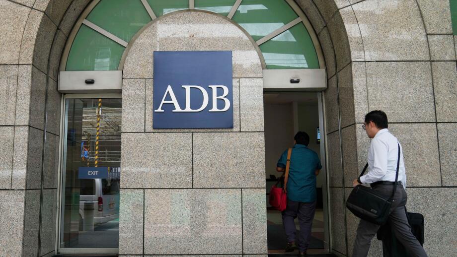 A man enters the Asian Development Bank (ADB) headquarters in Manila, Philippines on Tuesday, April 15, 2025. (AP Photo/Aaron Favila)
