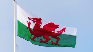 Wales flag flying on a sunny day.