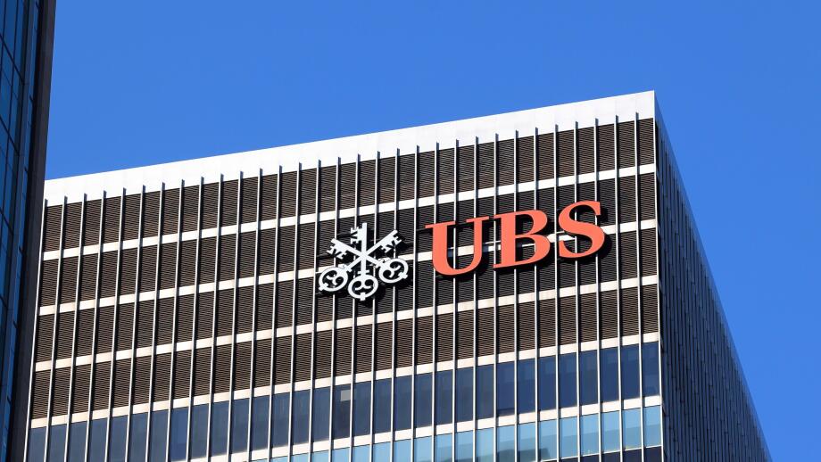 The logo of UBS AG can be seen from the street near their 1285 6th Ave headquarters building in New York City.